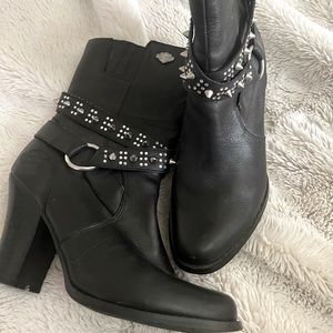A sassy woman’s heeled boot  Harley-Davidson buckles, straps, and studs.
